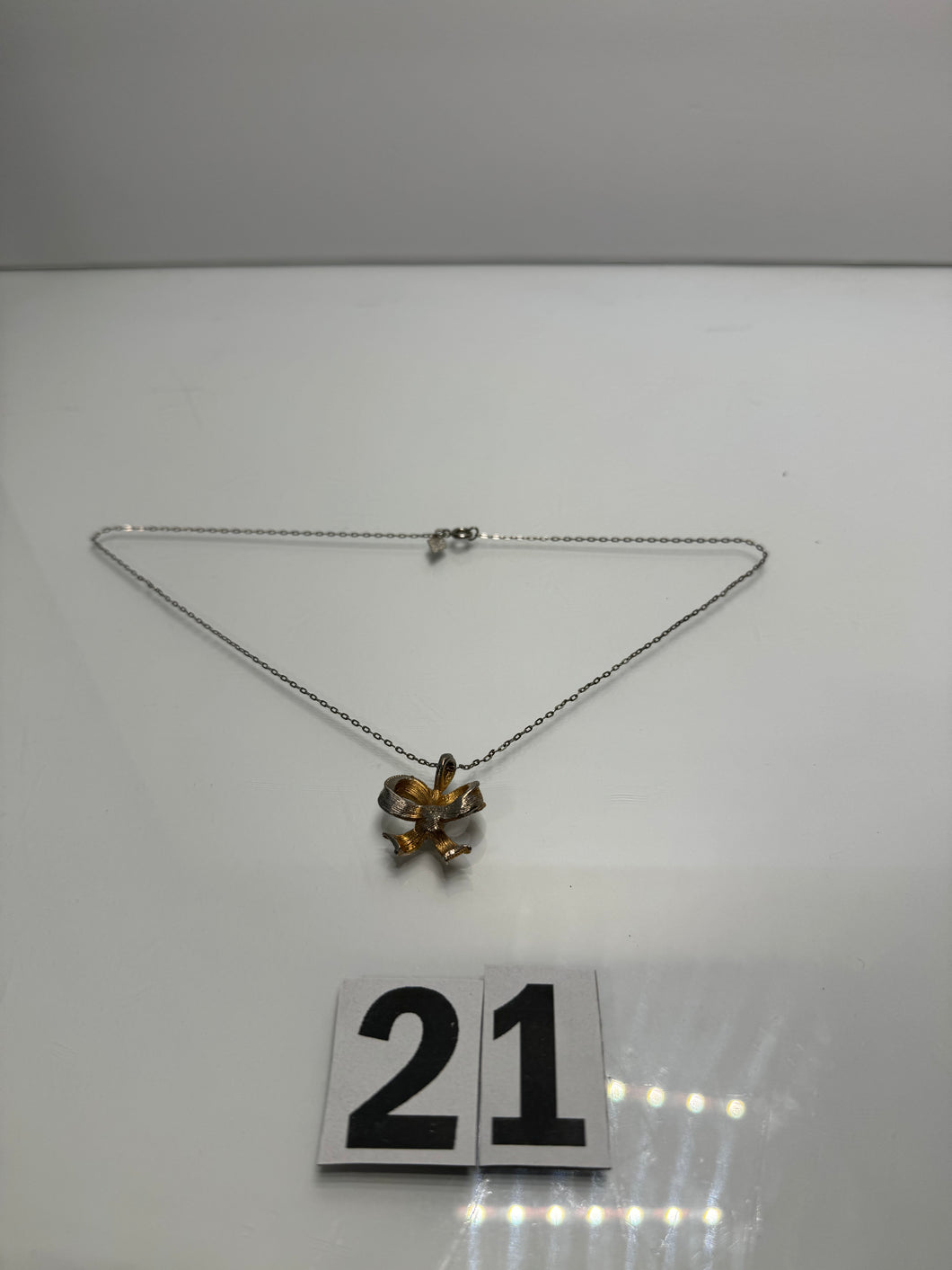 Chrome Bow Necklace